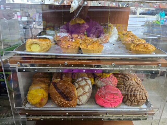 Freshly baked pan dulce pastries displayed at Favorite Produce